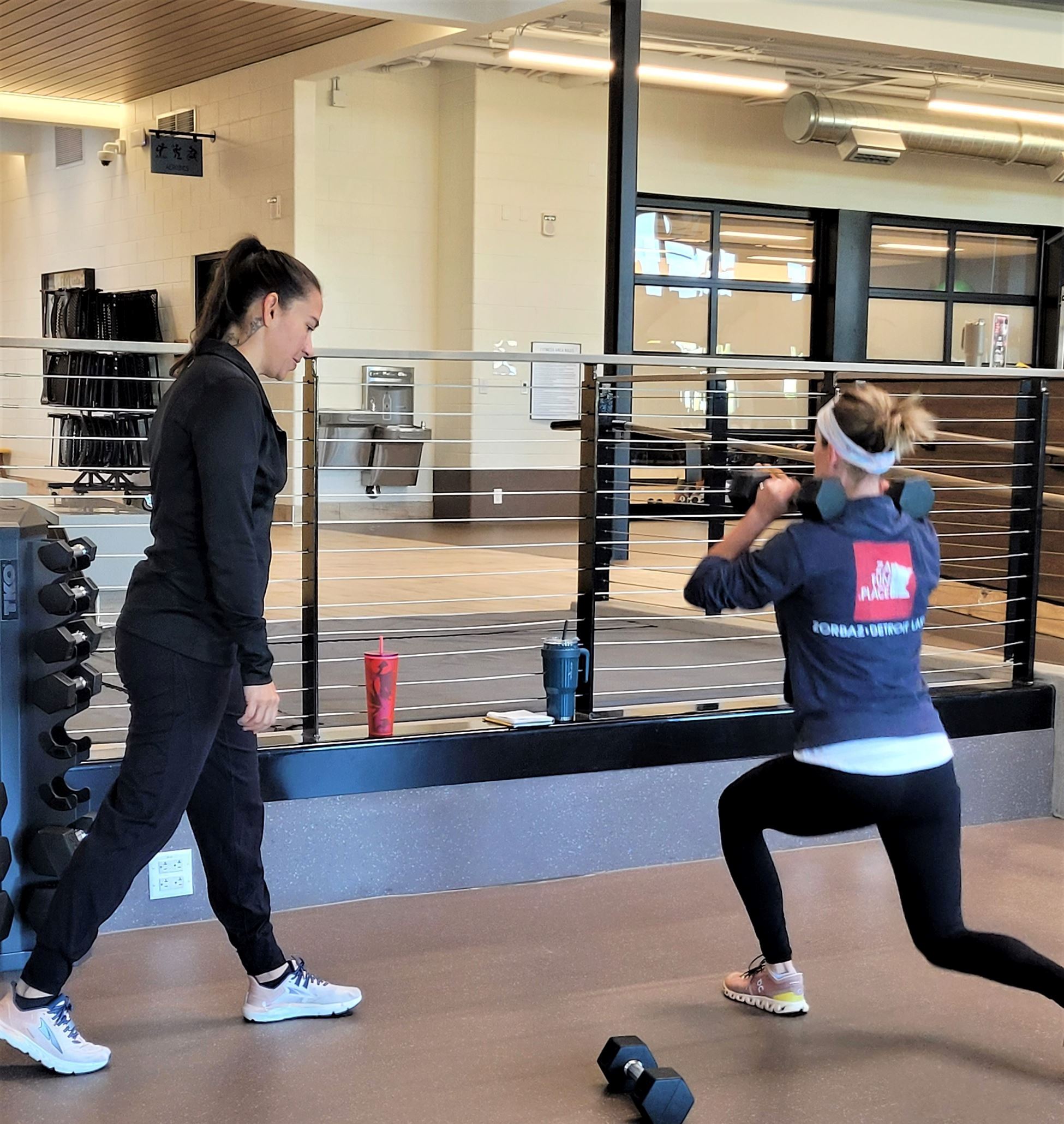 Personal training training a client