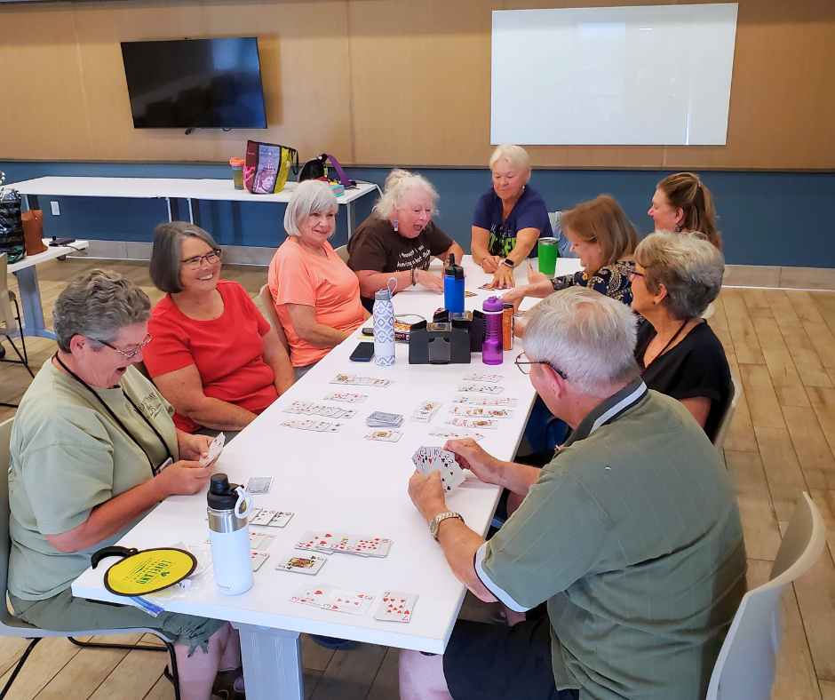 Photo of active adults playing card games