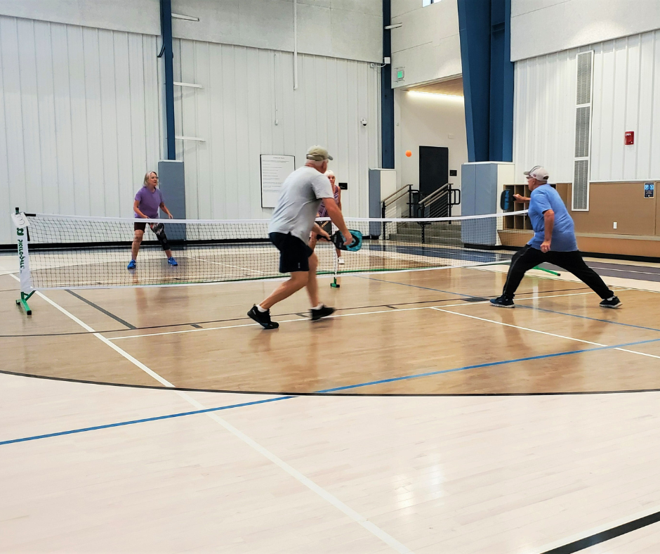 Photo of an adult pickleball game