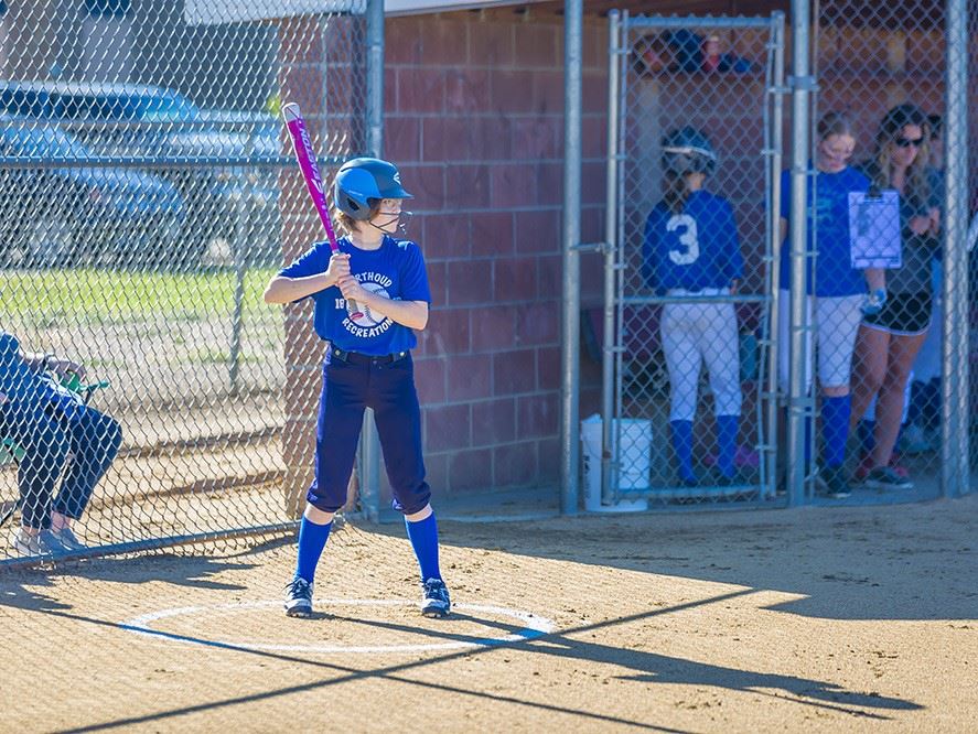 Photo of an 12U softball player in the on deck circle