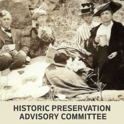 Old photo of four people enjoying a picnic