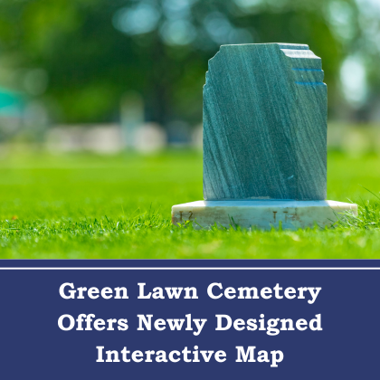Headstone in grassy cemetery